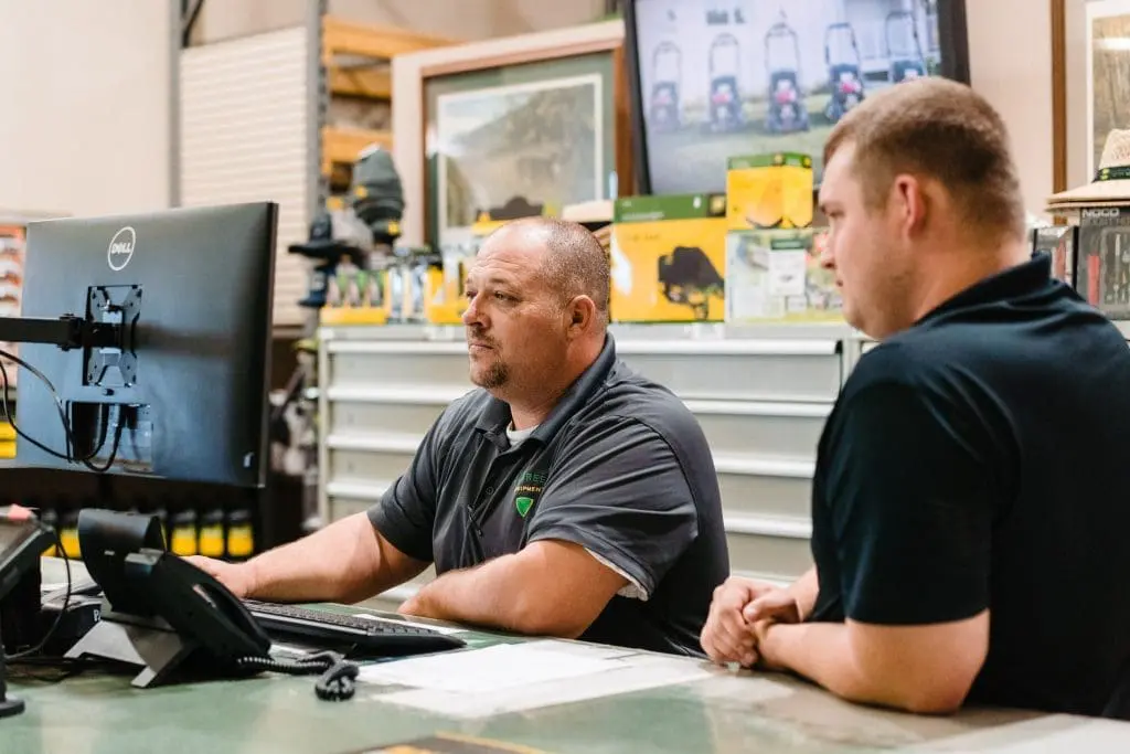 men at parts desk