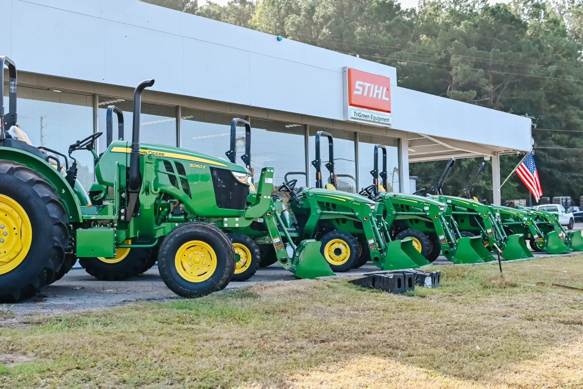 John Deere tractors outside a John Deere store in Pelham, AL