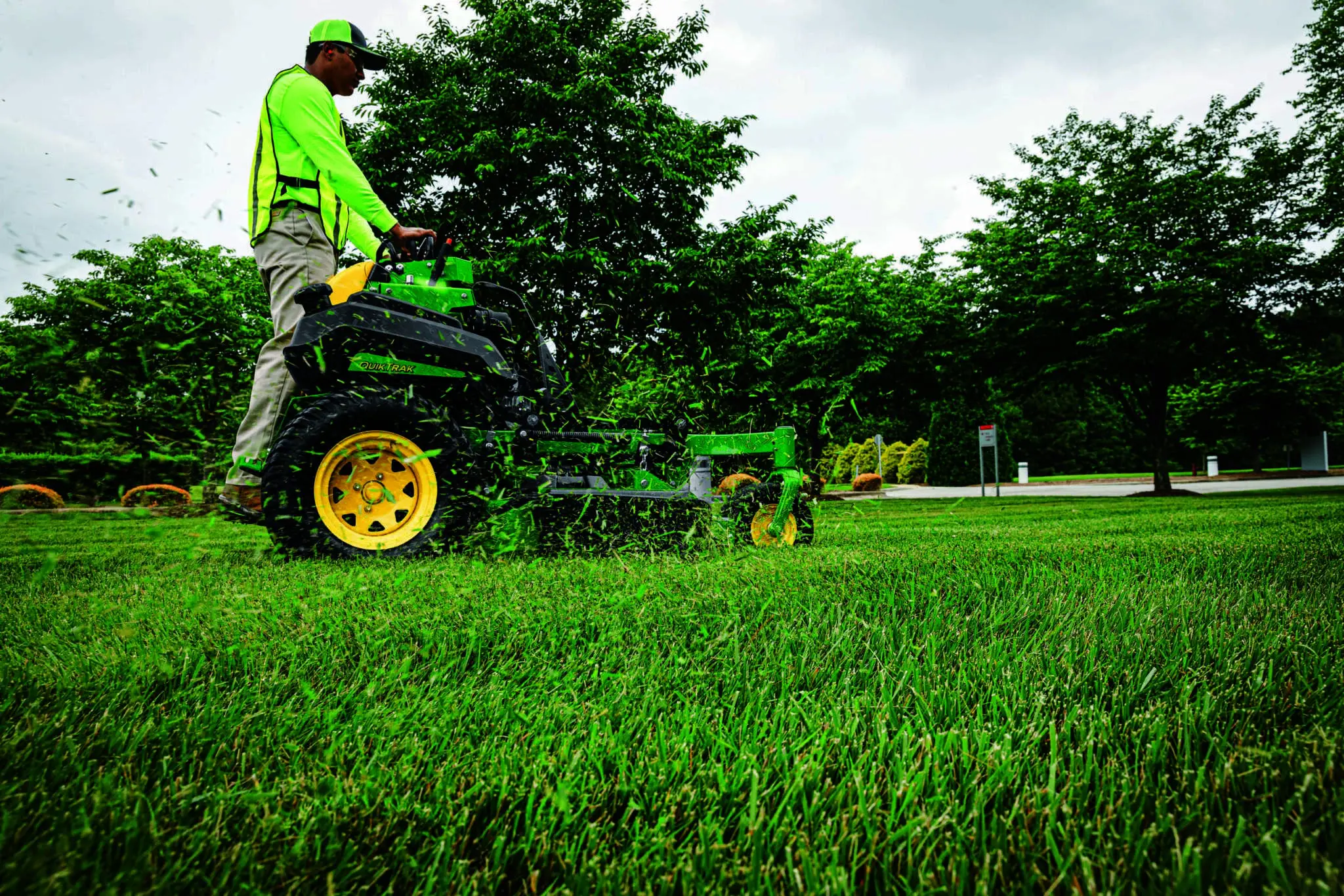 Technician operating QuikTrak mower