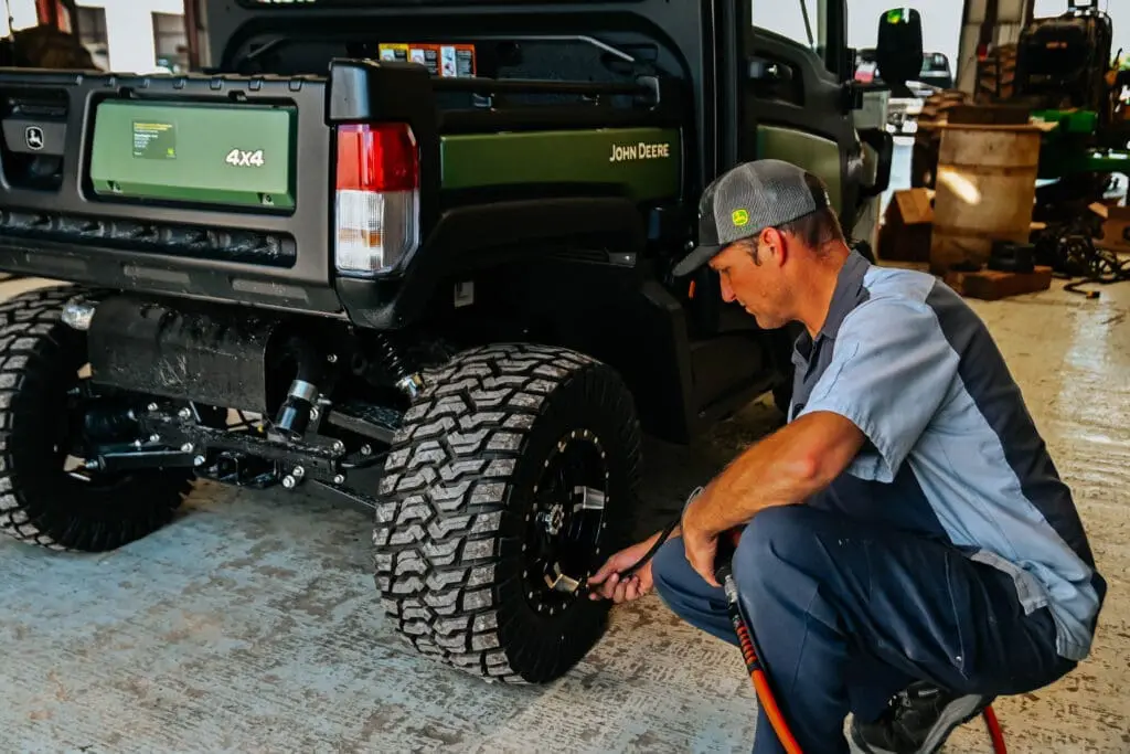 Technician repairing UTV tire