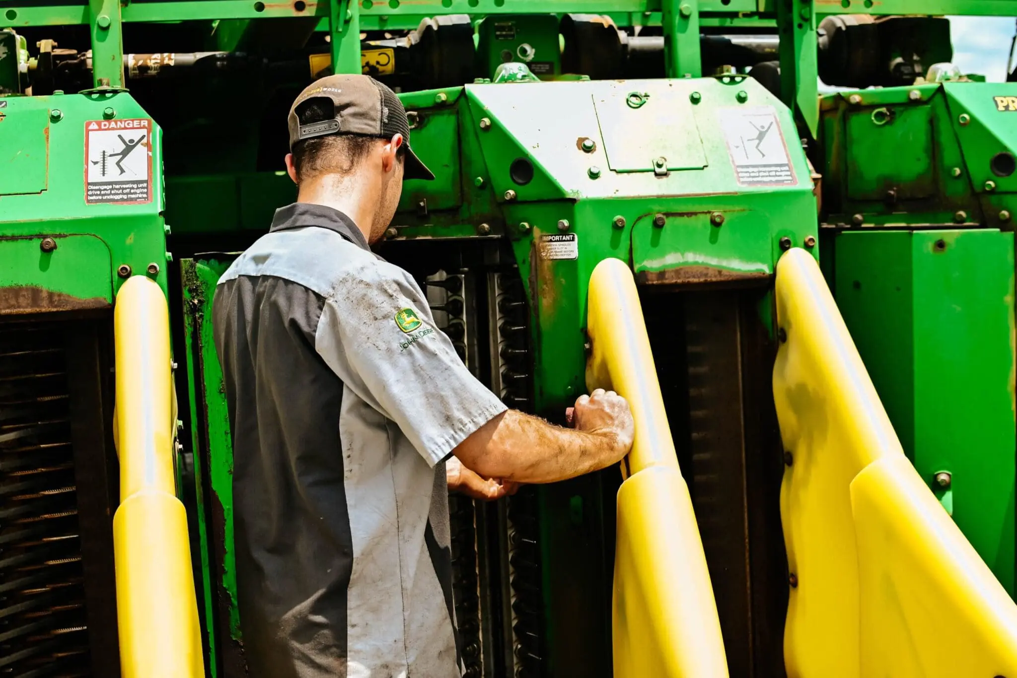 Technician inspecting ag equipment 