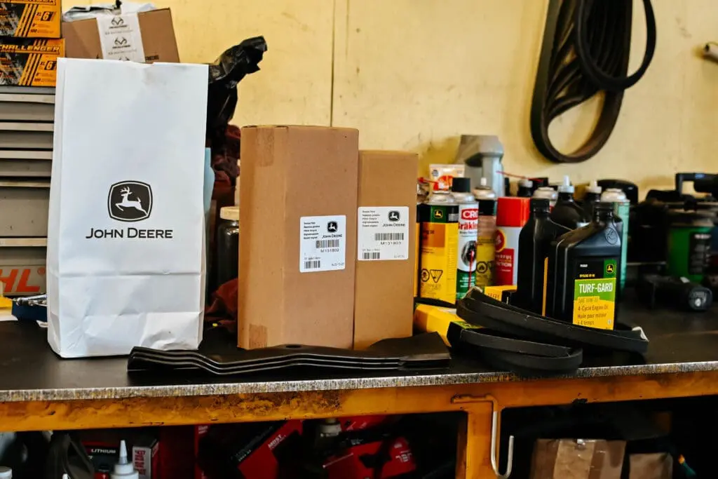 an assortment of fluids for lawn mower maintenance