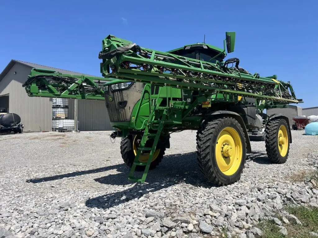 A used sprayer for sale on a farm lot