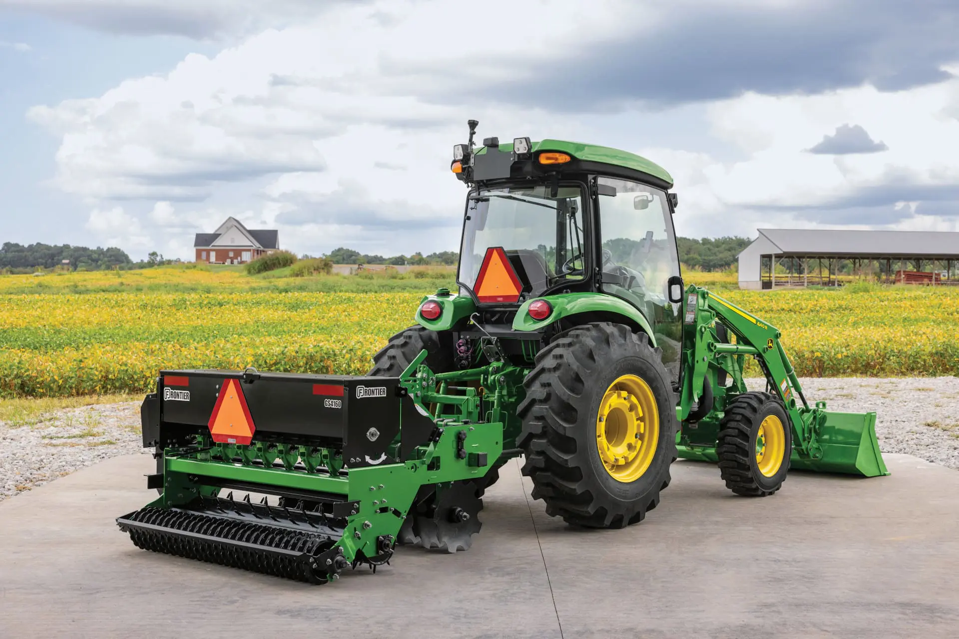 A John Deere 5075R tractor parked on a farm