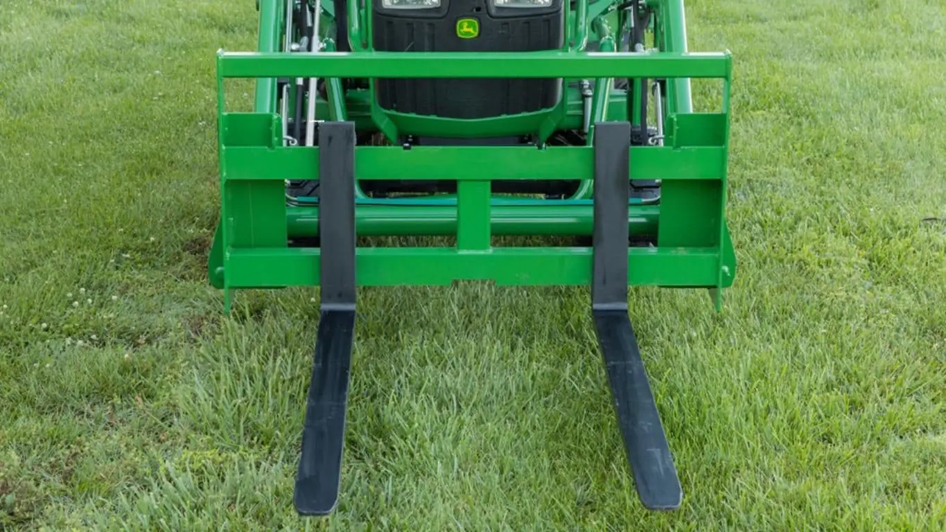 Pallet forks on John Deere compact tractor