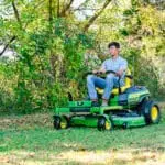 A man mows on a Z330R ztrak mower