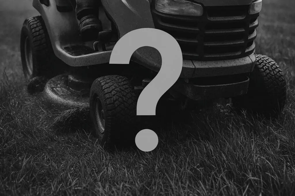 greyscale image of John Deere lawn tractor mowing wet grass. A large, grey question mark is pasted over the image.