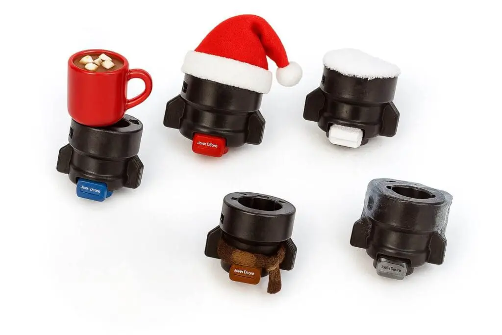 A variety of John Deere sprayer nozzles, humorously winterized