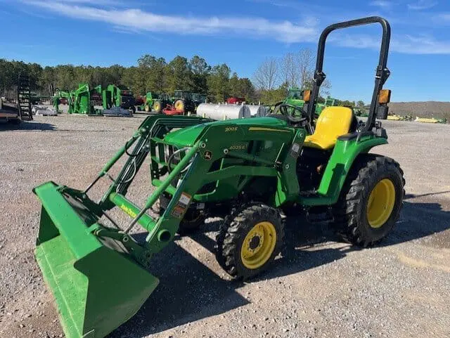 2022 John Deere 3025E compact tractor in gravel lot on a sunny day