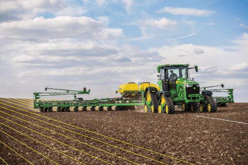 Farmer plants with AutoPath auto steer precision technology