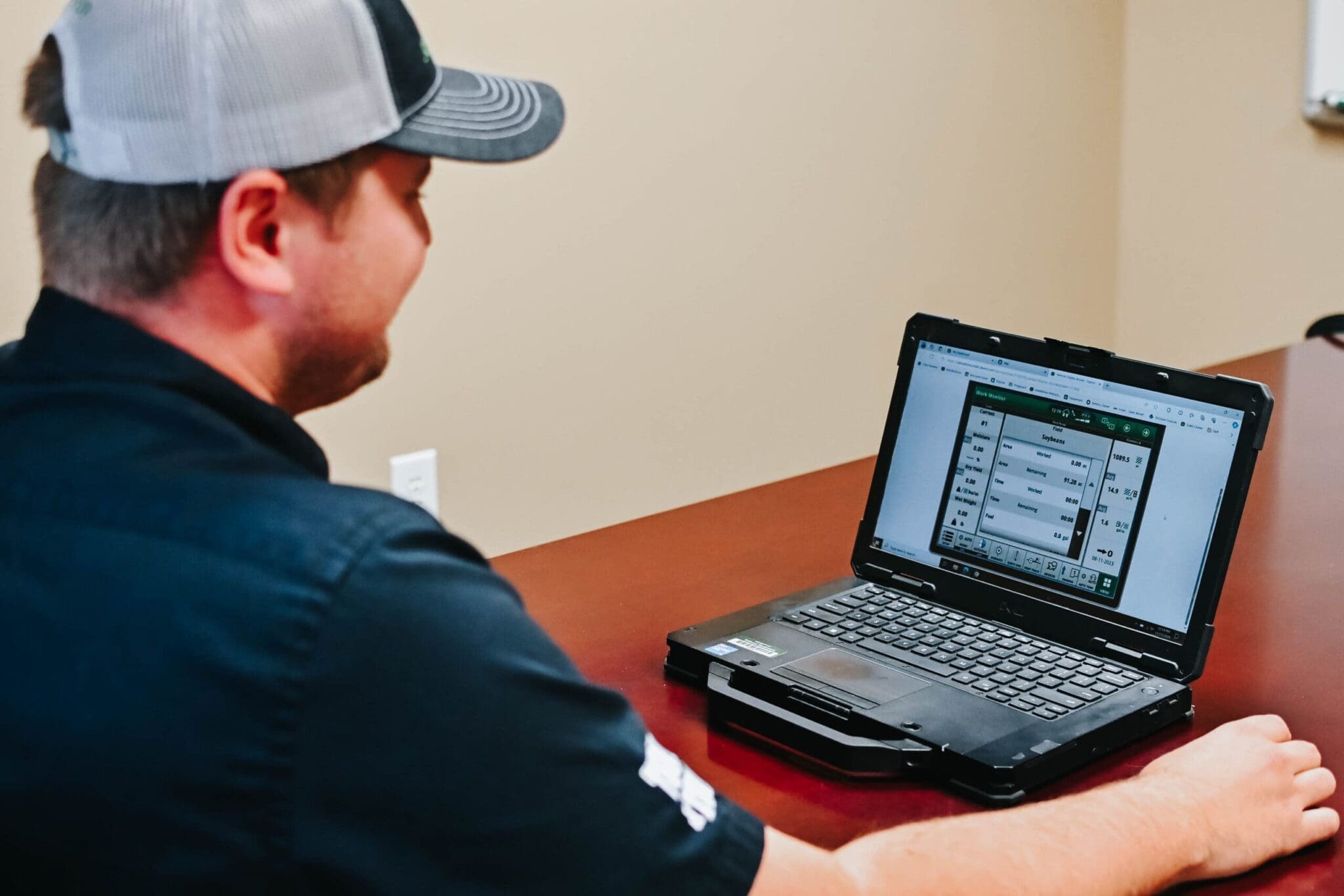 Precision Ag technician checking data