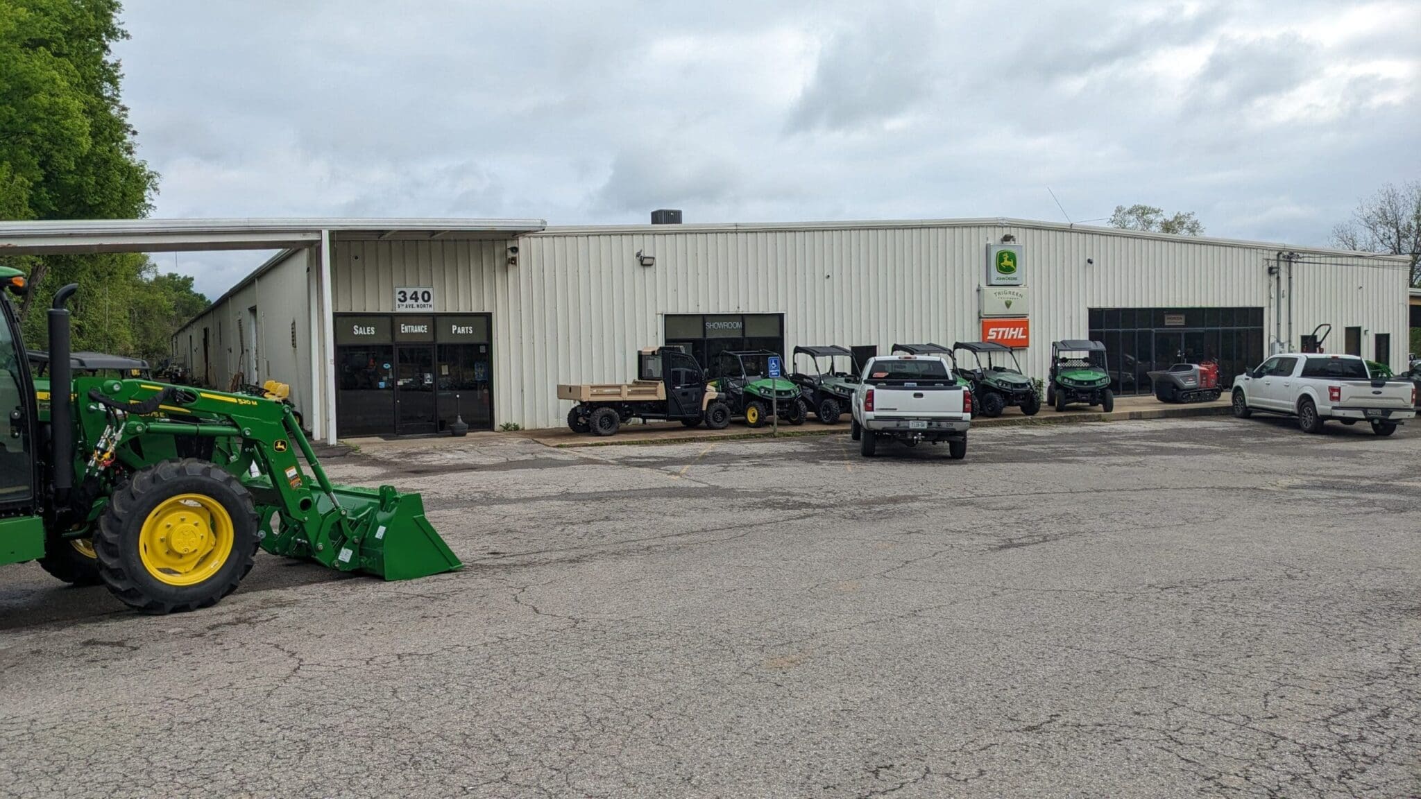 A John Deere tractor in front of a dealership in Franklin, TN