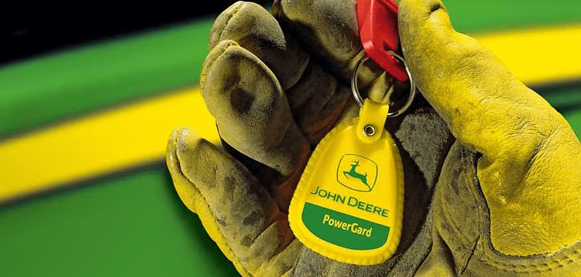 Technician holding John Deere PowerGard Keys