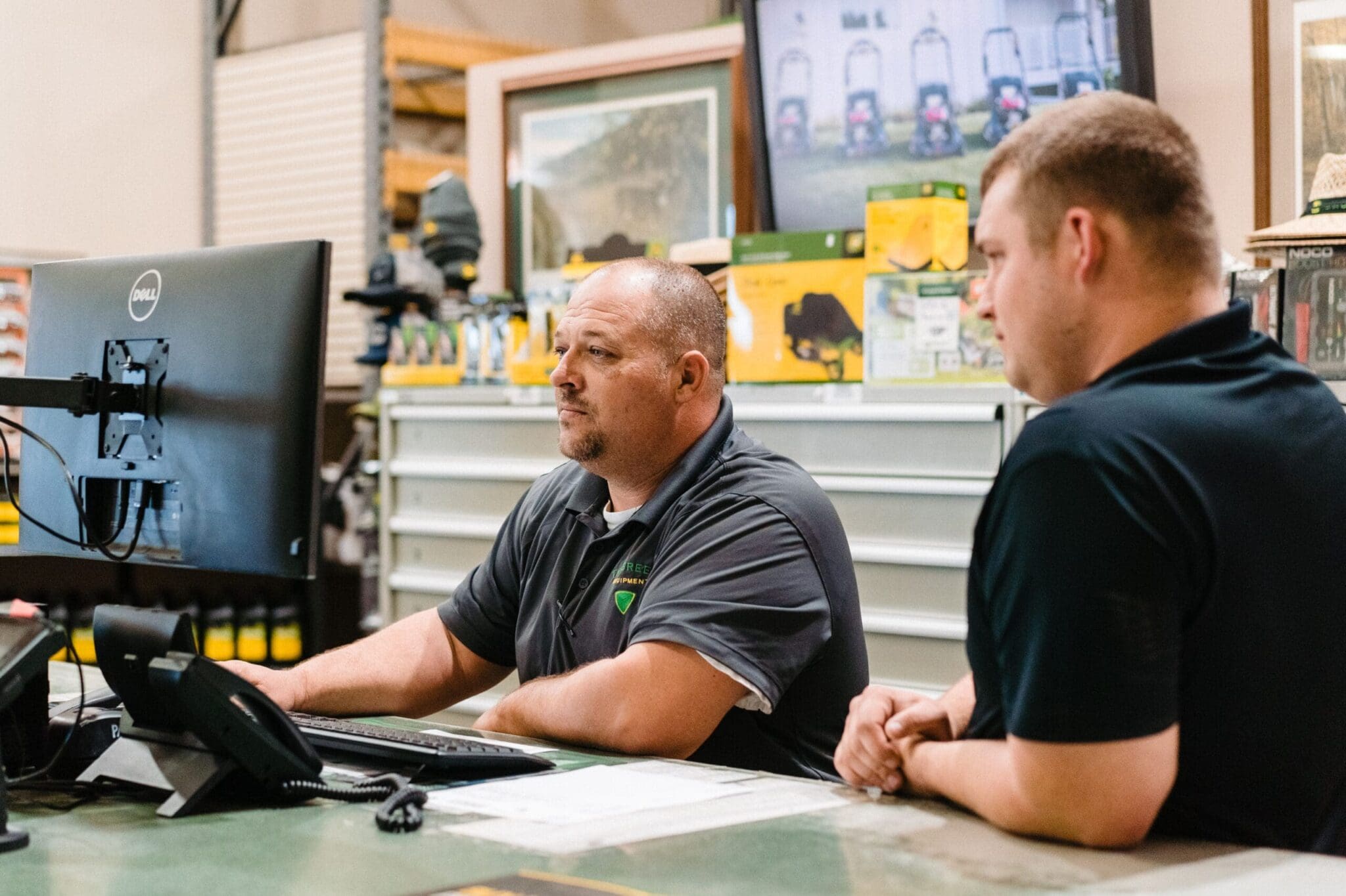 Technicians examining computer