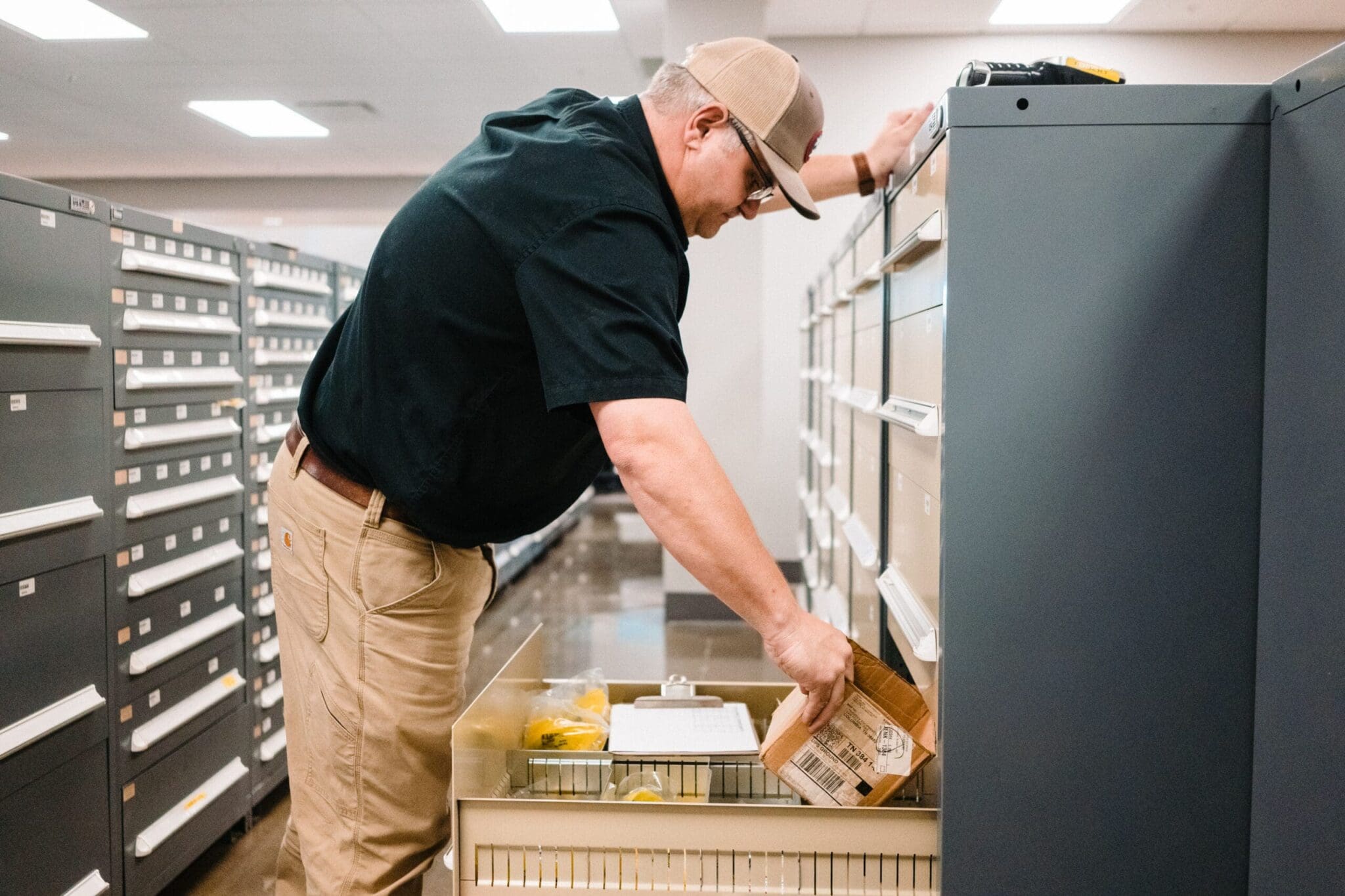 Technician retrieving parts