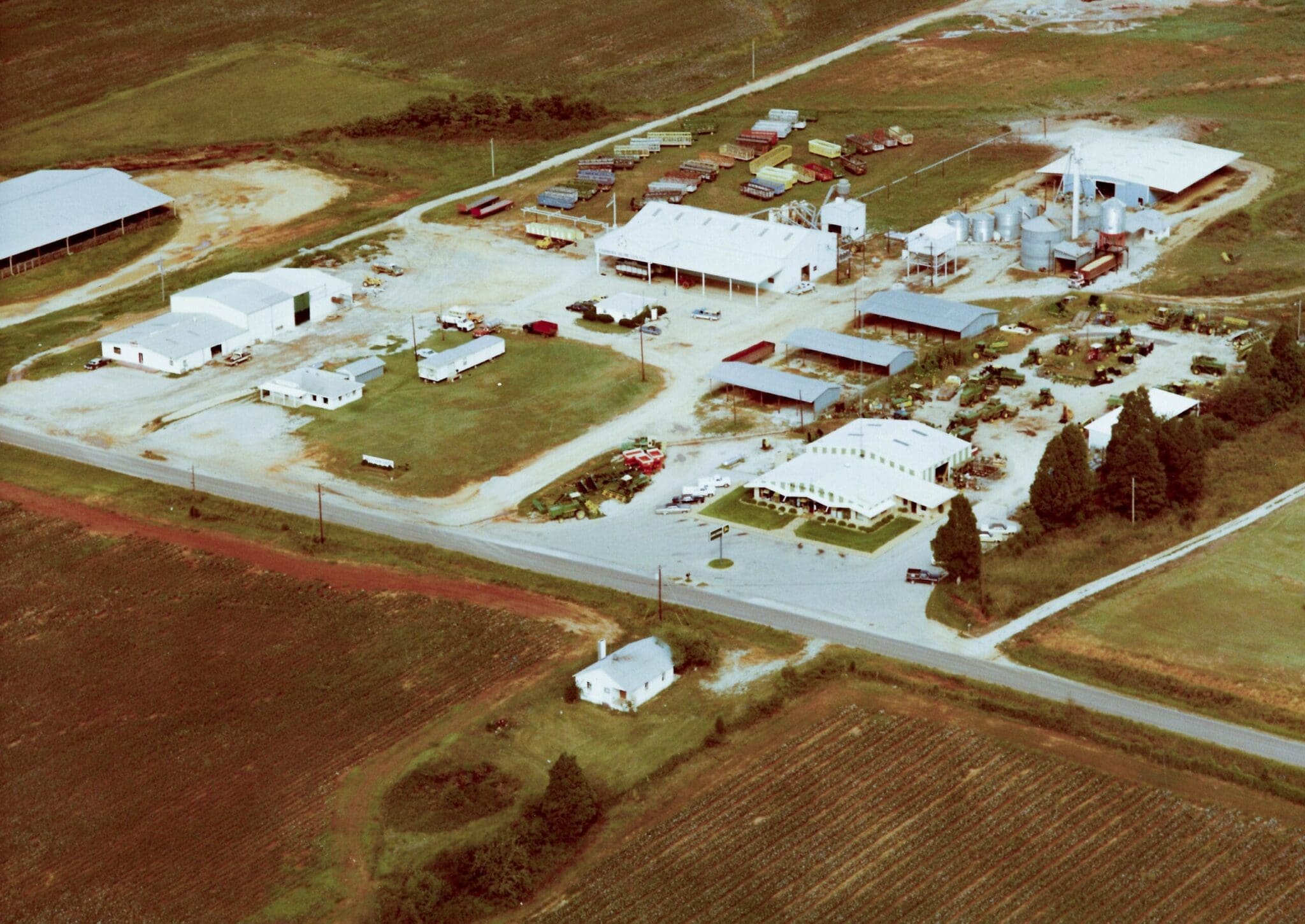 A historical image of a John Deere dealership in Leighton, AL