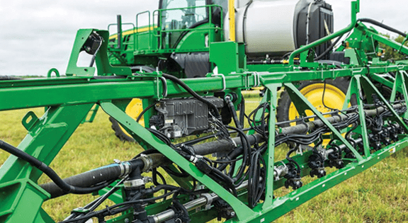 A John Deere sprayer boom with See and Spray Precision Upgrade Kit installed