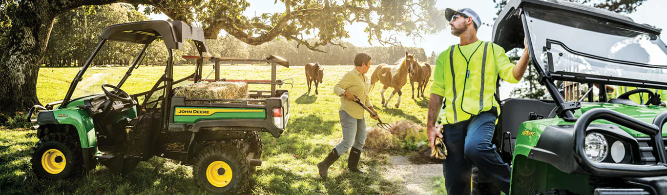 landowners delivering hay bales to horses