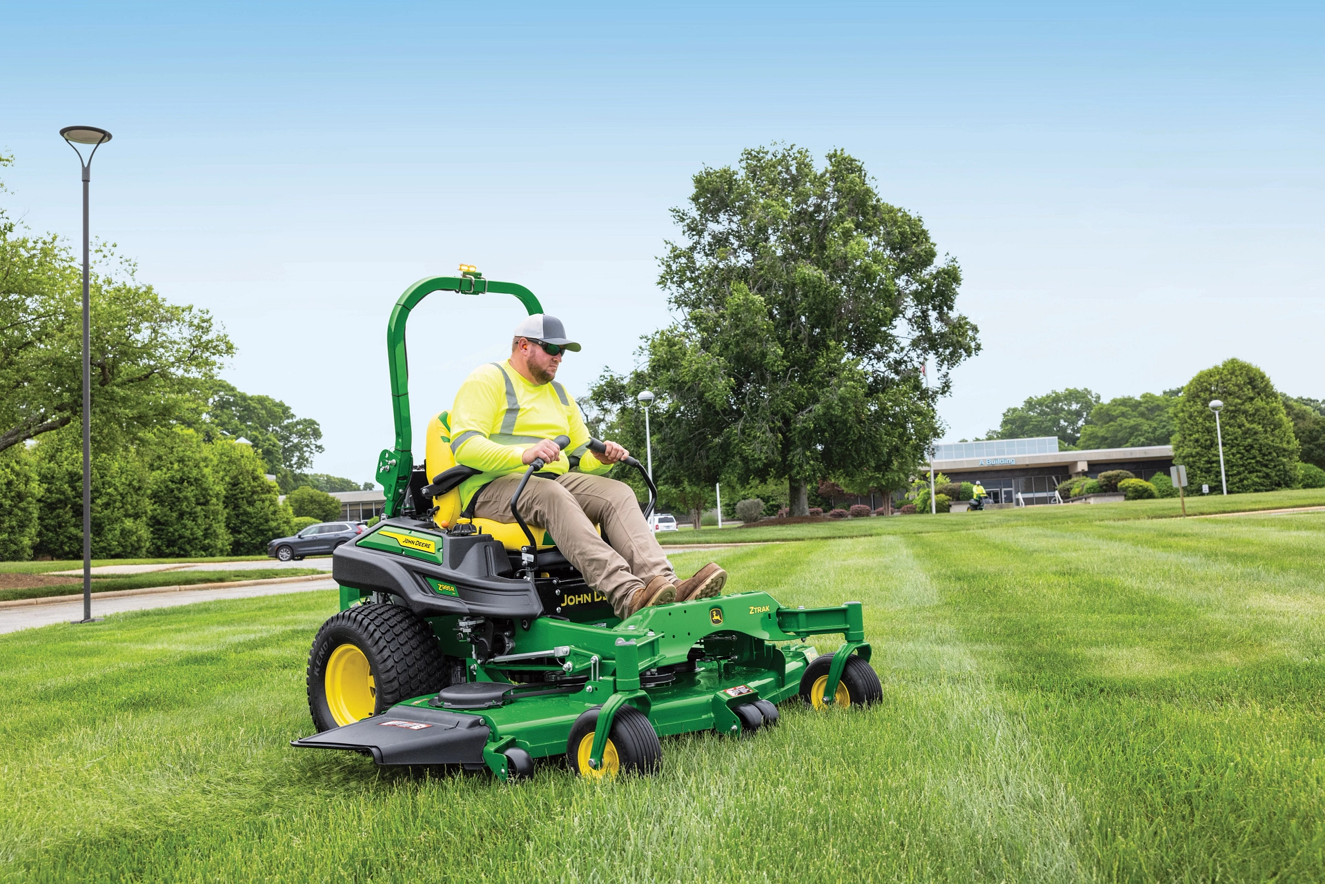 Man drives across freshly-mown lawn on John Deere Z985R commercial ZTrak Zero Turn Mower