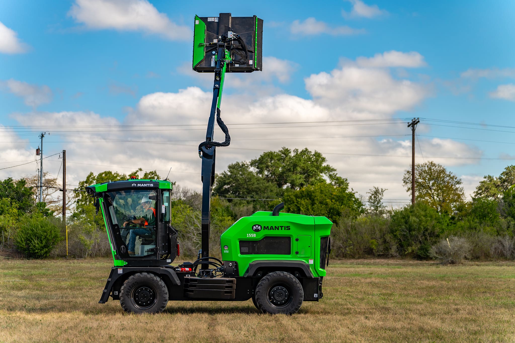 A Mantis roadside mower in a field